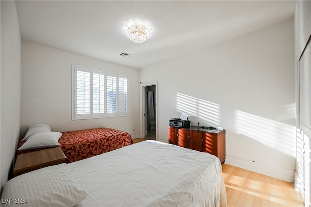 bedroom featuring light hardwood / wood-style floors