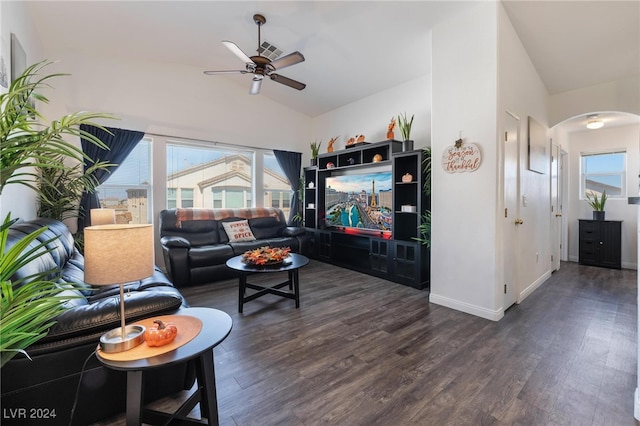 living room with lofted ceiling, ceiling fan, and dark wood-type flooring