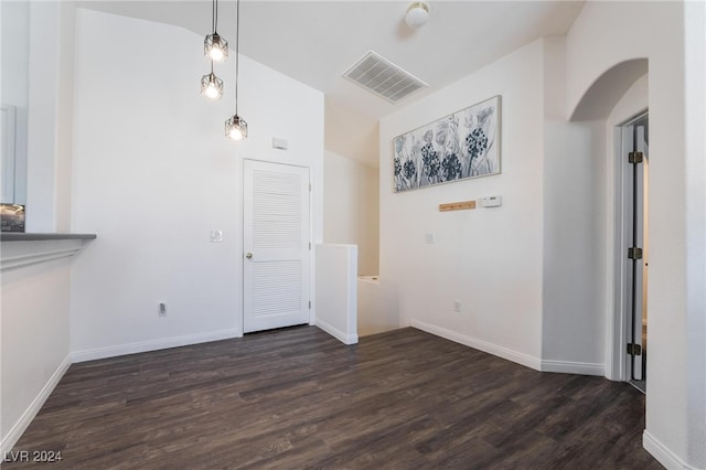 unfurnished dining area featuring dark hardwood / wood-style floors