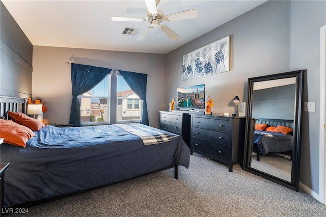 bedroom with ceiling fan, carpet, and lofted ceiling