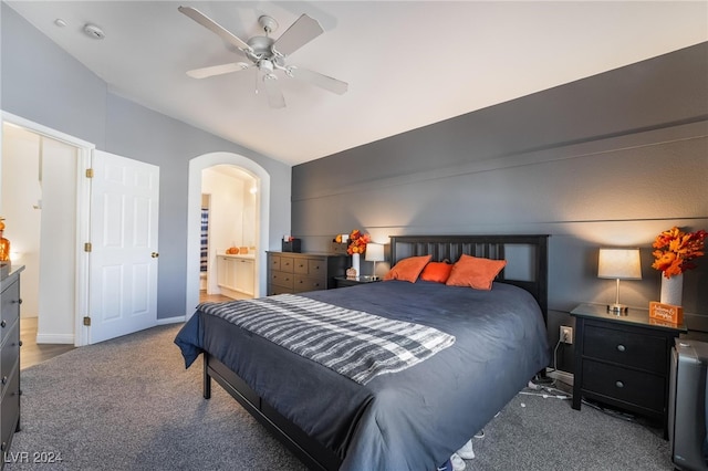 carpeted bedroom featuring ceiling fan and connected bathroom