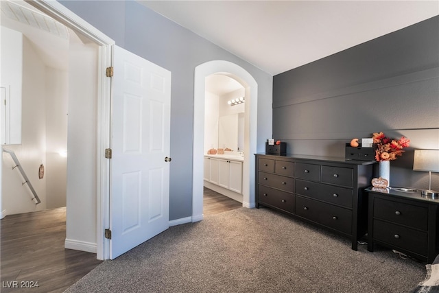 carpeted bedroom with ensuite bathroom