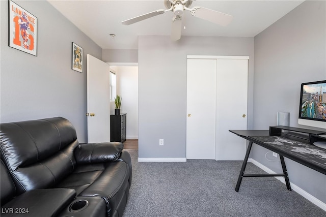 carpeted office with ceiling fan