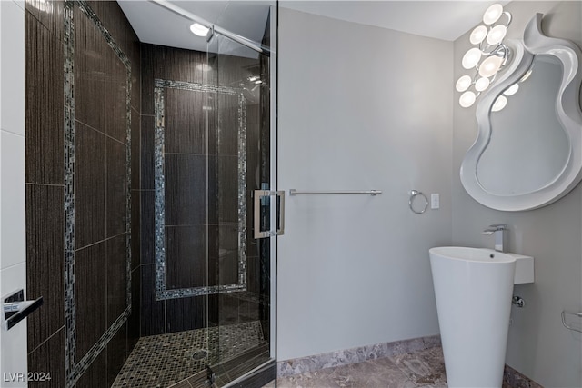 bathroom with a shower with shower door