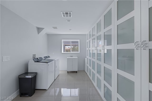 laundry room with washer and clothes dryer