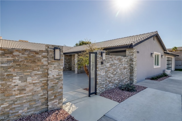 view of home's exterior featuring a patio area