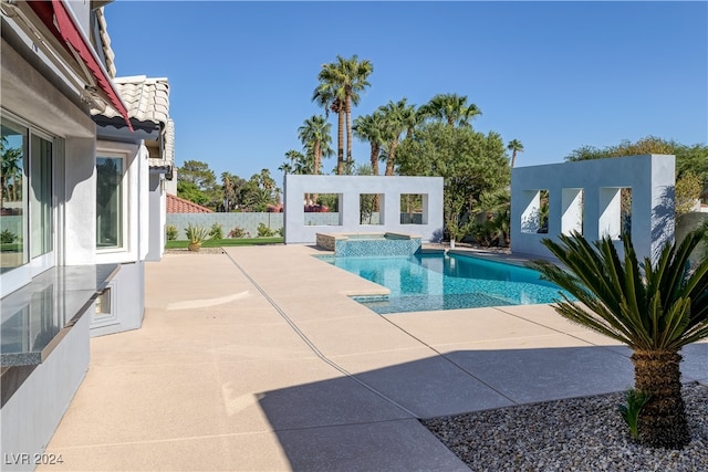 view of swimming pool featuring a patio area