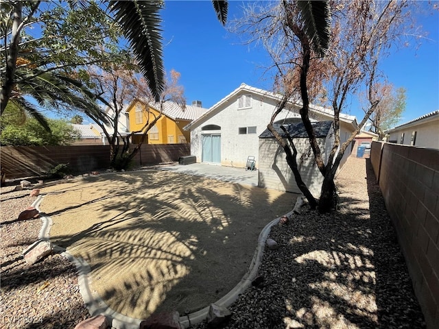 back of property featuring a patio