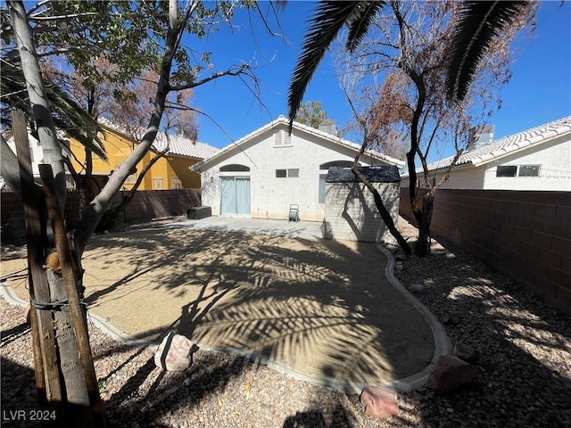 rear view of house with a patio