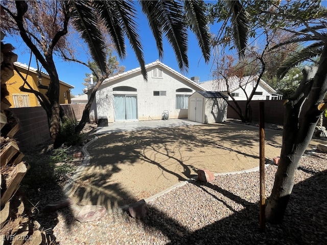 back of house with a patio area