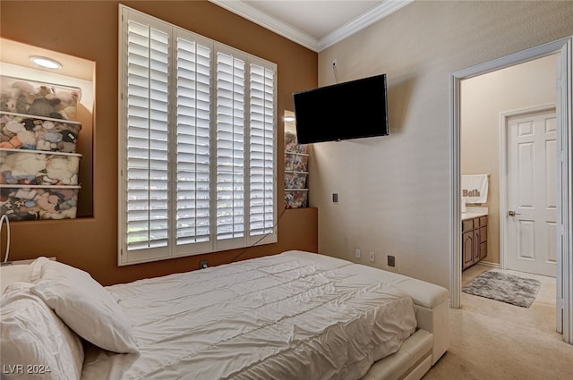 carpeted bedroom featuring ensuite bathroom, multiple windows, and crown molding