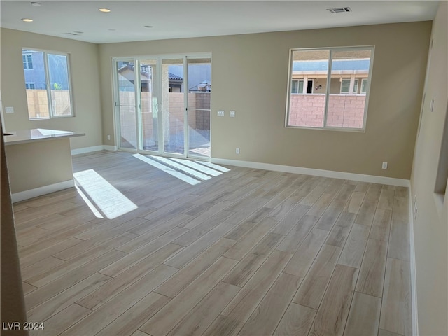 empty room with light wood-type flooring