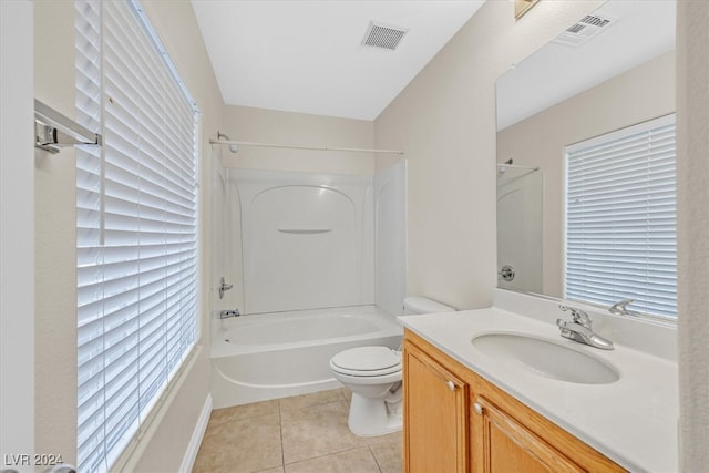 full bathroom featuring toilet, vanity, tile patterned flooring, and  shower combination