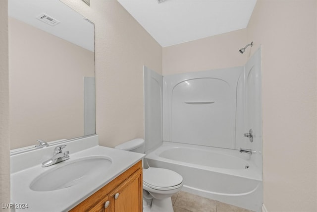 full bathroom featuring vanity, tile patterned flooring, washtub / shower combination, and toilet