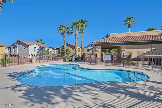 view of swimming pool featuring a patio area