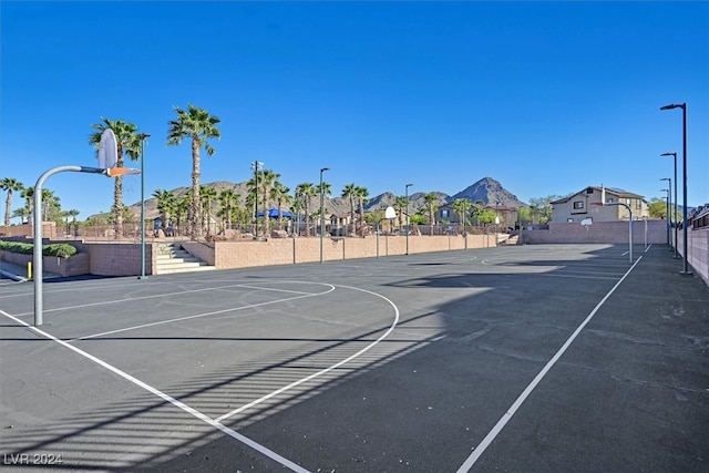 view of basketball court with a mountain view