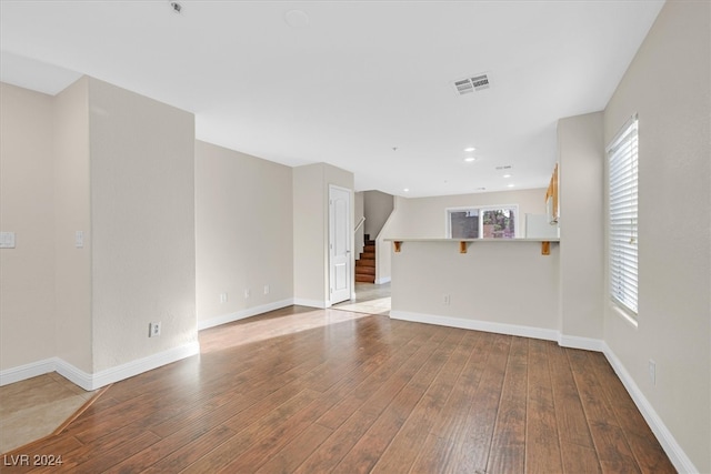 unfurnished living room featuring light hardwood / wood-style floors