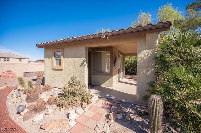 doorway to property featuring a patio area