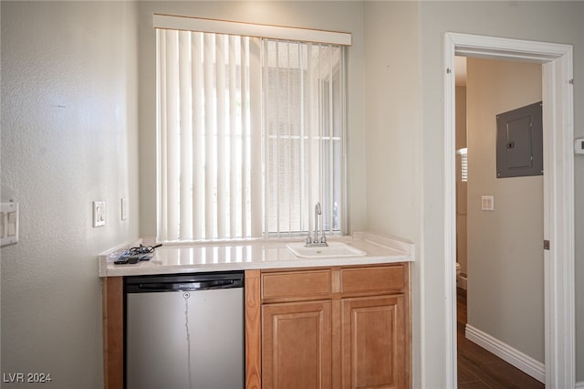 kitchen with dishwasher, electric panel, sink, and hardwood / wood-style floors