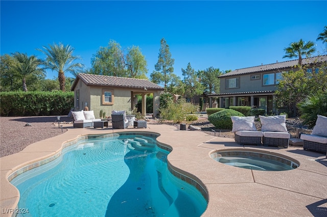 view of pool featuring an in ground hot tub, a patio area, and outdoor lounge area