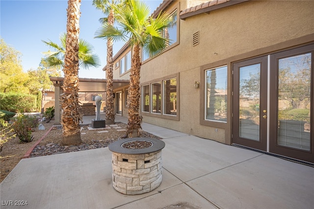 view of patio with a fire pit