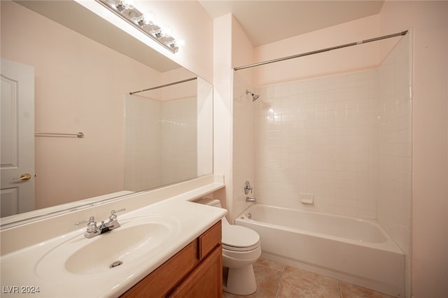 full bathroom with vanity, toilet, tile patterned floors, and tiled shower / bath