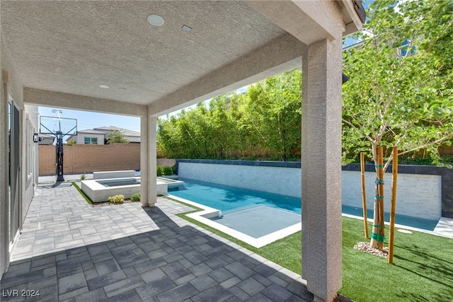 view of pool with a yard and a patio area