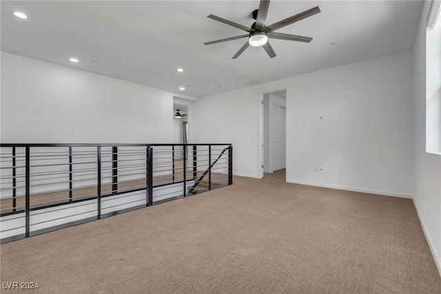 unfurnished room featuring carpet floors and ceiling fan