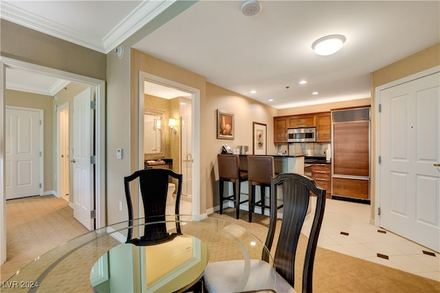 tiled dining area with crown molding