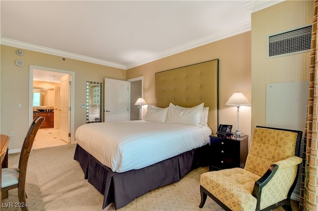 bedroom with connected bathroom and ornamental molding