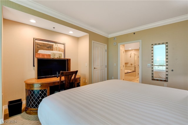 bedroom featuring crown molding and connected bathroom