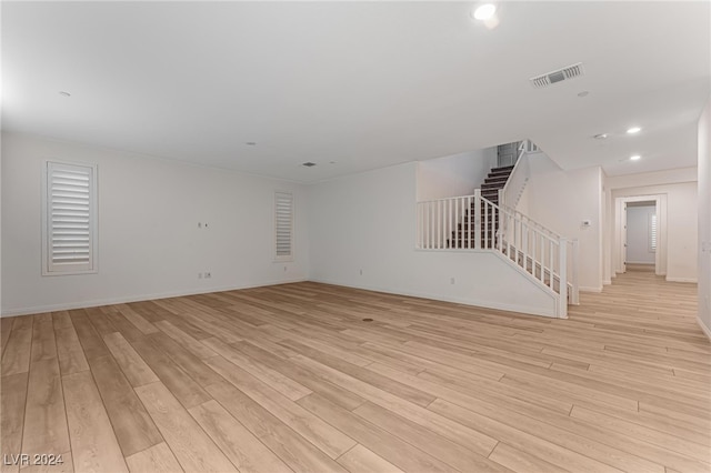 unfurnished living room featuring light wood-type flooring