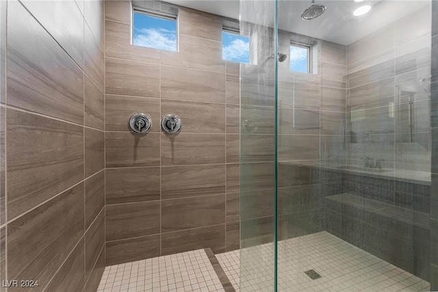 bathroom with a tile shower