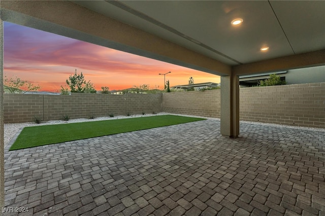 view of patio terrace at dusk