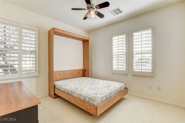 carpeted bedroom featuring ceiling fan