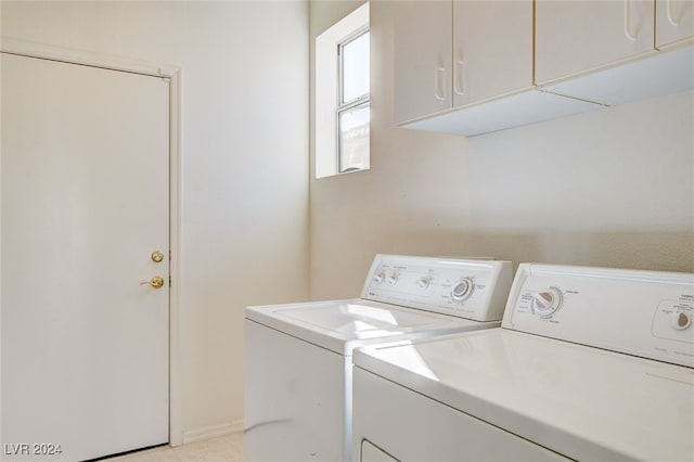 laundry room featuring cabinets and independent washer and dryer