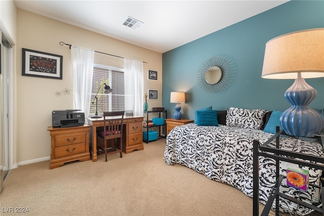 bedroom featuring light colored carpet