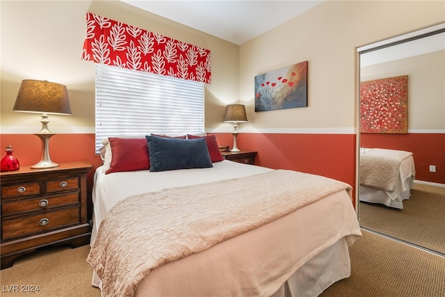 carpeted bedroom with a closet