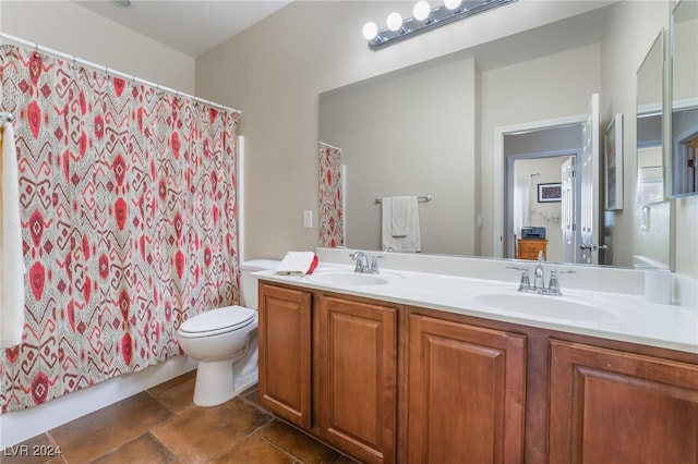 bathroom featuring vanity, toilet, and a shower with shower curtain