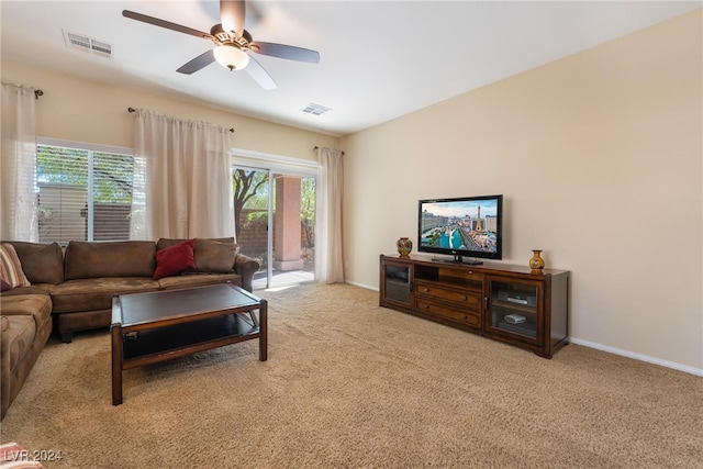 living room featuring ceiling fan and light colored carpet