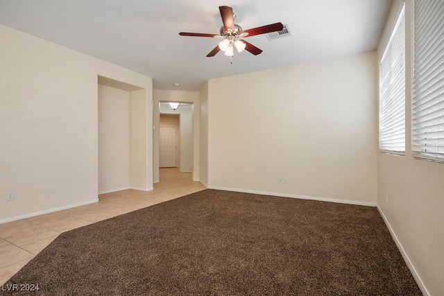 carpeted empty room with ceiling fan