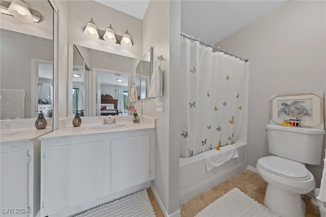 full bathroom with shower / bath combination with curtain, tile patterned flooring, vanity, and toilet