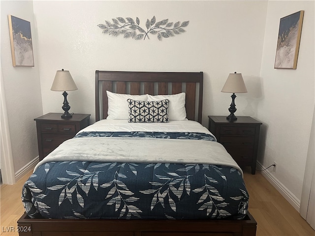 bedroom with light hardwood / wood-style flooring