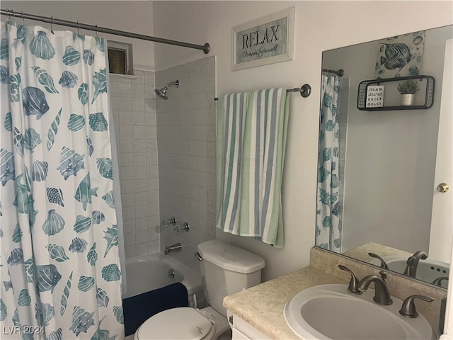 full bathroom featuring shower / bath combo, vanity, and toilet