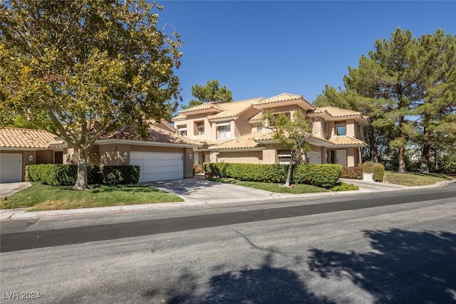 mediterranean / spanish house featuring a garage