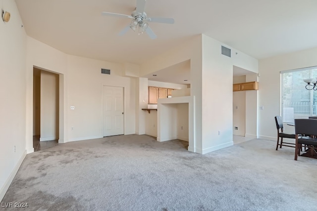 living room featuring ceiling fan and light colored carpet