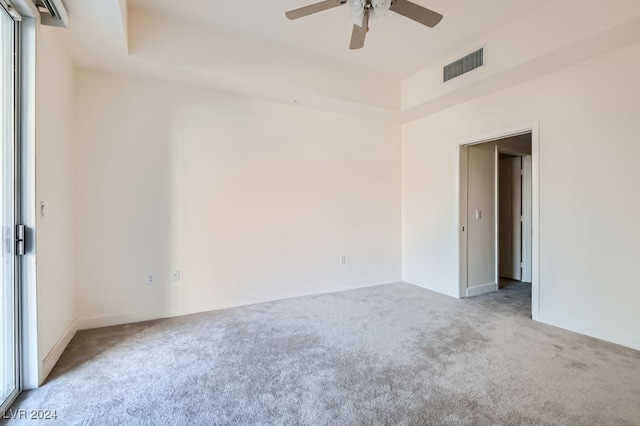 carpeted empty room with ceiling fan