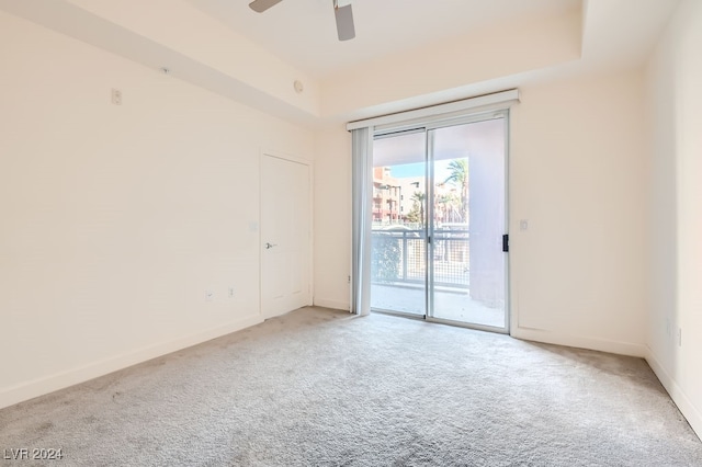 spare room with ceiling fan and carpet flooring