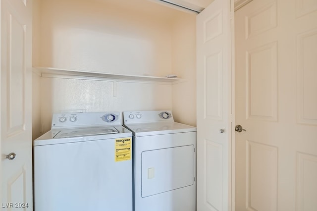 clothes washing area featuring independent washer and dryer