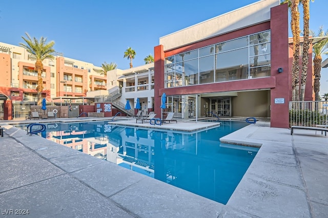 view of swimming pool with a patio area